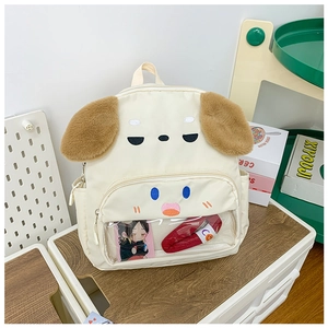 Close-up of cute puppy backpack with transparent front pocket and plush ears