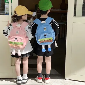 Cute cartoon burger backpack for kids in pink and blue colors with 3D legs detail