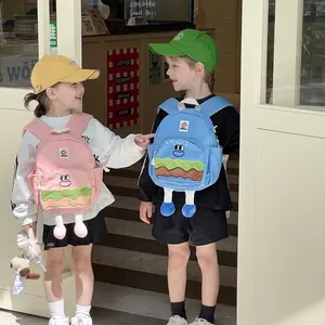 Cartoon hamburger backpack for kids in pink and blue colors with plush 3D leg details
