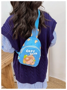 Close-up of blue Capybara chest bag for kids featuring cute cartoon print and zipper details