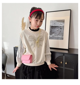 Toddler girl wearing pink mini crossbody bag with gold chain and rhinestone bow vest