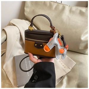 Girl's brown leather mini box bag with top handle, crossbody strap and pony charm detail