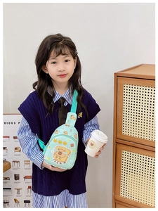 Close-up of mint green canvas kids chest bag with cartoon toast bear print and zipper