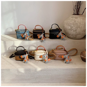 Mini box-shaped children handbags in various colors featuring cute pony charms