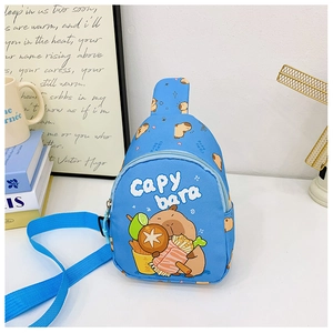 Close-up of blue Capybara chest bag with adjustable strap in a cozy indoor setting
