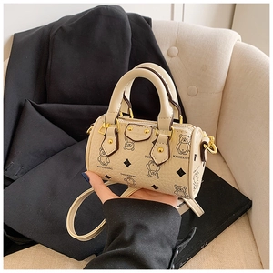 Detail of mini bear print Boston bag with gold-tone hardware and leather handle