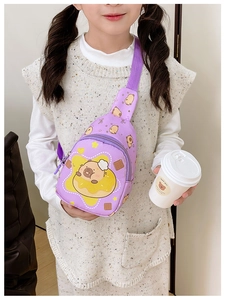 Detail of purple crossbody bag with cartoon bear and donut print for children