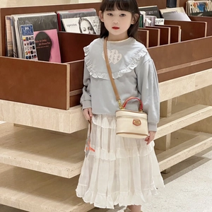Mini lychee texture girls' handbag in beige with a stylish top handle and boxy design