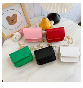 Mini crossbody bags for kids in five vibrant colors with gold metal chain straps