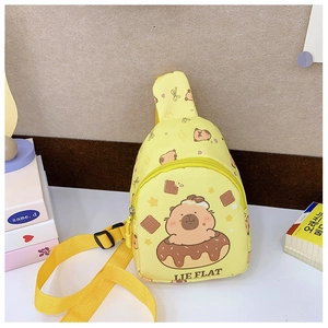 Detail of yellow canvas kids bag featuring Kapibara cartoon and adjustable strap