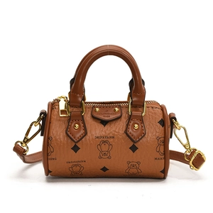 Brown mini Boston bag for kids with bear pattern and gold-tone hardware on white background
