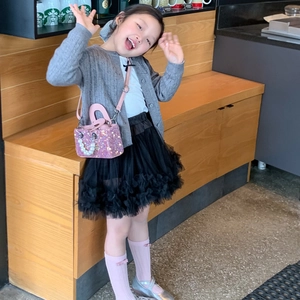 Pink sequin mini handbag for girls paired with gray knit cardigan and tulle skirt