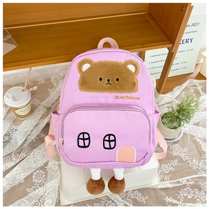 Close-up of pink children house backpack featuring cute 3D plush bear embroidery details