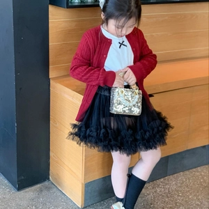 Fashionable red knit cardigan with tutu skirt and gold sequin handbag for young girls