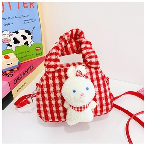 Detail of red and white plaid plush bag with a cute 3D bunny and detachable strap