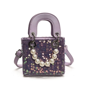 Sweet purple sequin mini handbag for girls featuring large pearl handle and silver chain