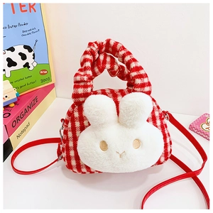 Detail of red checkered plush girl's bag featuring a large white rabbit head and red strap