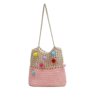 Handmade crochet shoulder bag with colorful pom-poms and pink-beige woven contrast design
