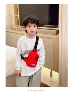 Front view of kid's red chest bag with adjustable strap and TONGHUO brand label