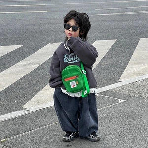 Kids streetwear style with green nylon crossbody square bag and grey hoodie outfit
