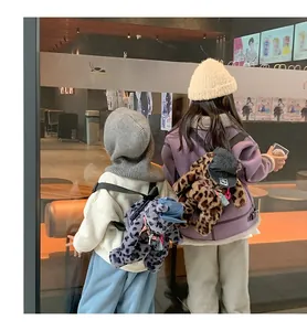 Kids plush leopard print backpack with bear ears and mini cap accessory detail