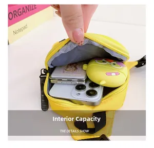 Interior view of yellow nylon chest bag showing storage for phone and accessories