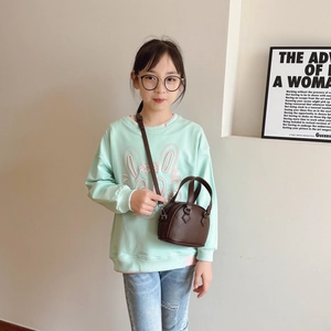 Brown shell-shaped crossbody bag for children with litchi grain and top handles