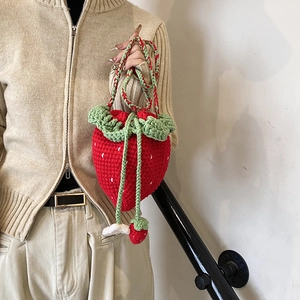 Handmade crochet strawberry crossbody bag for women with red yarn and green leaf lid