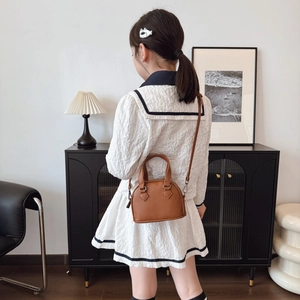 Classic brown PU leather mini shell bag for kids with round handle and shoulder strap