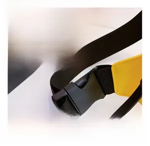 Detail of durable black nylon strap with plastic buckle closure for kids chest bag