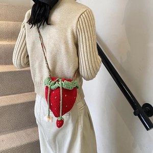 Handmade strawberry crochet crossbody bag for women with green leaves and flower strap