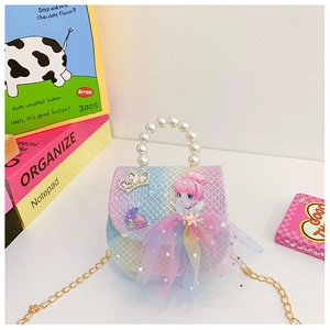 Detail of rainbow girl bag with pearl handle, sequin crown, and 3D princess design
