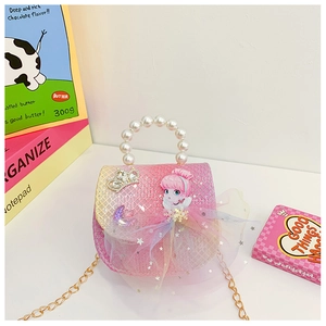 Detail of pink gradient glitter girl handbag with pearl handle and crown embellishment