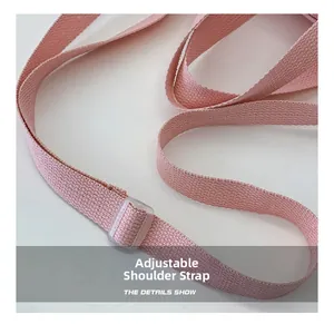 Close-up of pink canvas adjustable shoulder strap with plastic buckle for kids bucket bag