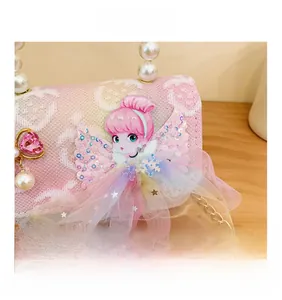 Detailed view of pink lace kids purse with white pearl handle and fairy sequin motif