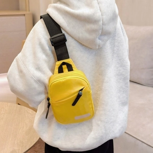 Kids yellow nylon crossbody chest bag with adjustable black strap for casual outdoor sports