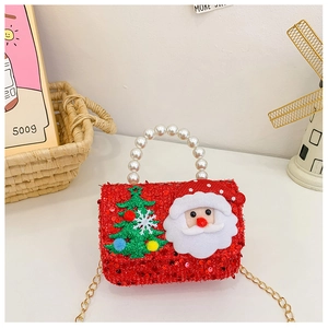 Detail of red sequin kids Christmas bag with Santa embroidery and pearl handle strap