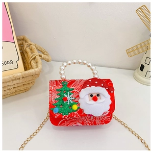 Close-up of red Christmas bag with Santa Claus decal and elegant white pearl handle