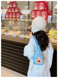 Blue Capybara crossbody bag for kids with adjustable strap and dual zipper pockets
