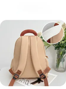Detail of breathable honeycomb mesh shoulder straps on a beige kids' ergonomic backpack