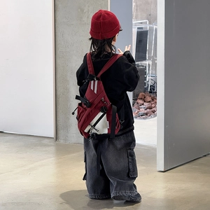 Kids streetwear crossbody bag with red and white color blocking and fashion tag