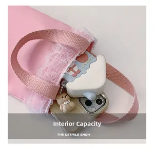 Internal capacity of pink girls lace tote bag showing space for phone and storage box