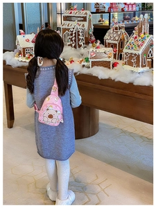 Pink child crossbody bag with cute cartoon bear print and floral accents for girls