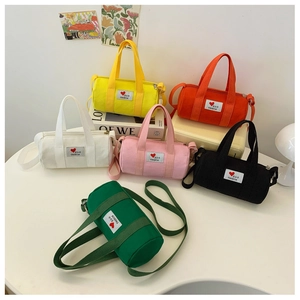 Detailed set of canvas bucket bags in six vibrant colors with fashion patches