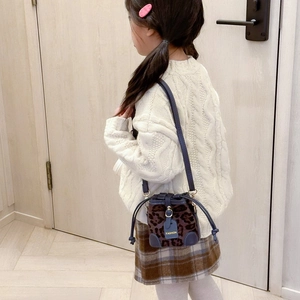 Stylish leopard print kids bucket bag with blue leather trim and fashion label