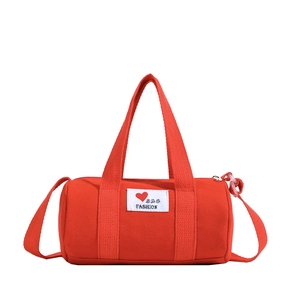 Red canvas bucket bag for kids with letter patch and adjustable shoulder strap