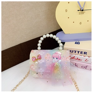 Detail of gradient mesh kids bag with pearl handle, pink princess motif, and golden chain