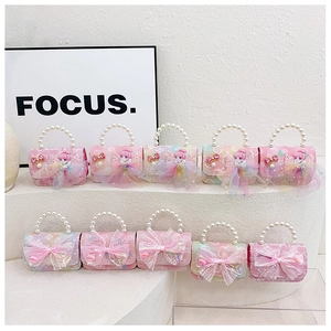 Collection of mini princess handbags with pearl handles and lace bow accents