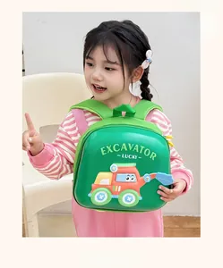 Detail of green EVA hardshell kids backpack featuring red excavator cartoon pattern