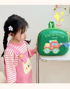 Close-up of green EVA hard shell toddler backpack featuring a 3D cartoon excavator design